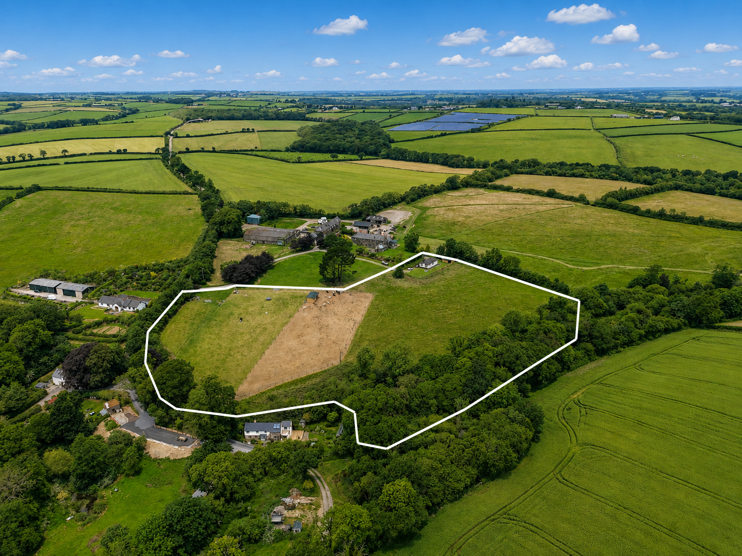 view across plot and adjacent land
